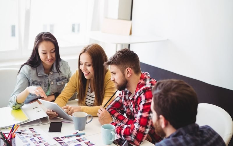 photo-editors-with-digital-tablet-in-meeting-room.jpg photo-editors-with-digital-tablet-in-meeting-room.jpg