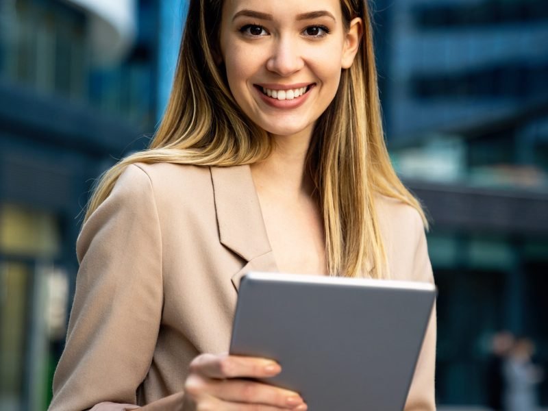 successful-businesswoman-using-a-digital-tablet-while-standing-in-front-of-business-building.jpg successful-businesswoman-using-a-digital-tablet-while-standing-in-front-of-business-building.jpg